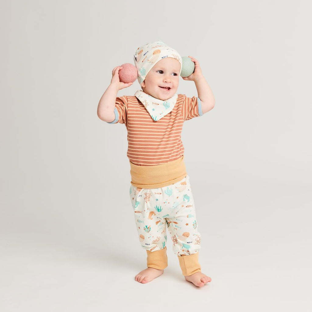 Organic reversible dribble bib Ocean Party"" made from 95% organic cotton and 5% elastane